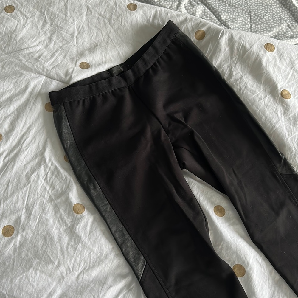Black Danier leggings with side leather detail. Elastic waistband. Size 6.